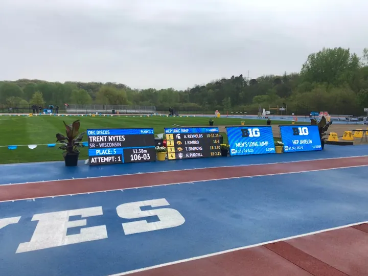 Several display boards set up across a stadium infield